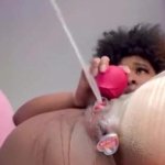 Squirting: Rose toy on clit buttplugged ebony