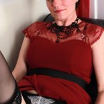 British housewife Olivia G. strips naked and rubs her wet pussy