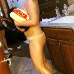 Amy Schumer Poses Nearly Nude While Holding a Hot Dog Dog