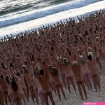 Bondi becomes nude beach as thousands take part in Spencer Tunicks Sydney installation