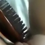 Girl uses hair brush to finish off
