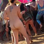 Brunette dancing nude in public at festival