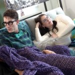Nerdy couple is fucking on the couch in front of the other girl