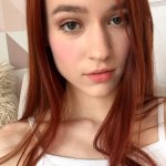 Skinny redhead fingering her shaved pussy in bed at Brdteengal