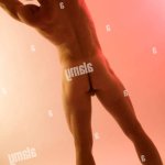 Naked male stretching to the side Stock Photo