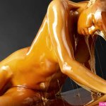 Golden honey dripped over naked models to create interesting sculptures